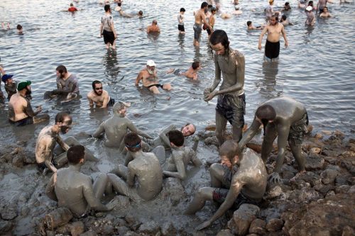 People enjoying Dead Sea mud