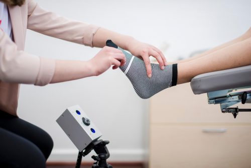 Podiatrist taking a scan for 3D printed orthotics